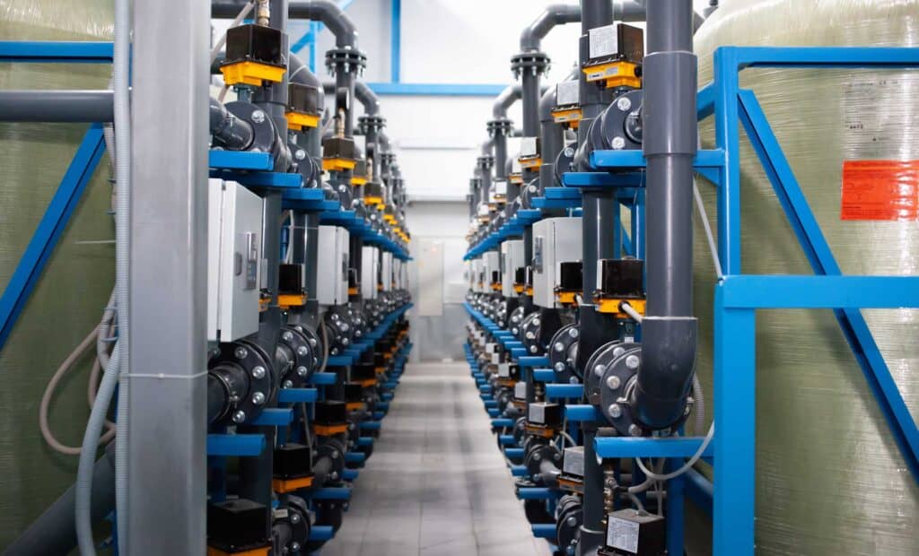 Purified drinking water factory or plant, large iron tanks and water purification filters and automation filtration system.
